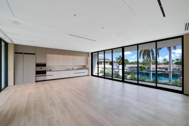 Empty room, Interior, Kitchen, Recessed Lighting, Stainless Steel Appliances, Water, Wood Texture Flooring