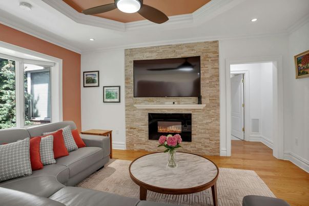 Fireplace, Interior, Living room, Recessed Lighting, Stone Walls, Wood Texture Flooring