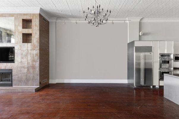 Empty room, Fireplace, Interior, Kitchen, Stainless Steel Appliances, Wood Texture Flooring