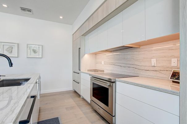 Interior, Kitchen, Marble Walls, Recessed Lighting, Stainless Steel Appliances, Wood Texture Flooring
