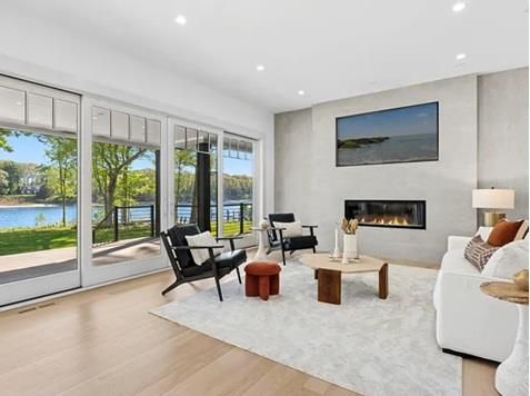 Fireplace, Interior, Living room, Recessed Lighting, Water, Wood Texture Flooring