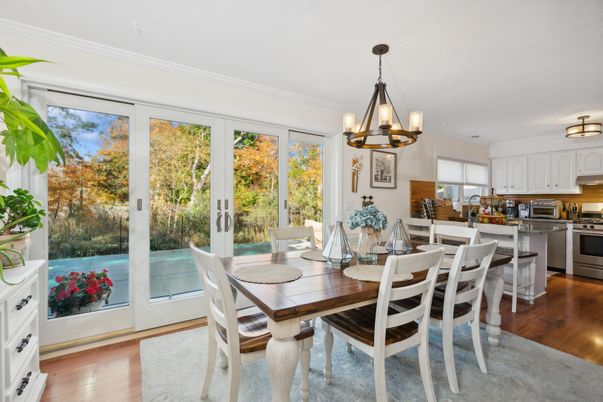 Chandelier, Dining room, Interior, Kitchen, Pendant Lights, Stainless Steel Appliances, Wood Texture Flooring