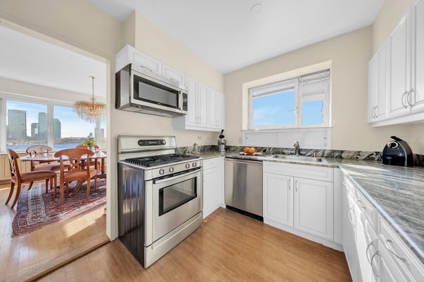 Chandelier, Dining room, Interior, Kitchen, Stainless Steel Appliances, Wood Texture Flooring