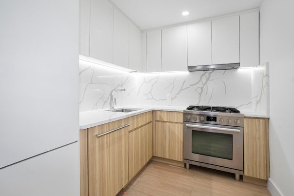 Interior, Kitchen, Marble Walls, Recessed Lighting, Stainless Steel Appliances, Wood Texture Flooring