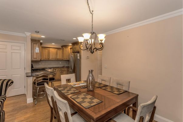 Chandelier, Dining room, Interior, Kitchen, Pendant Lights, Recessed Lighting, Stainless Steel Appliances, Wood Texture Flooring