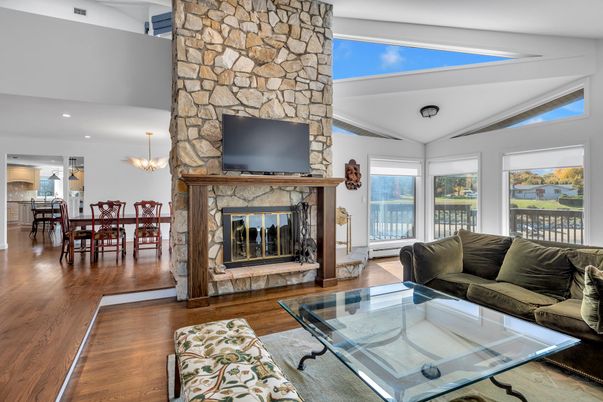 Chandelier, Dining room, Fireplace, Interior, Living room, Recessed Lighting, Stone Walls, Wood Texture Flooring