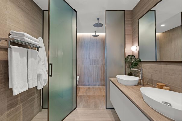 Bathroom, Dual Sink Vanities, Glass Shower, Interior, Recessed Lighting, Wood Texture Flooring