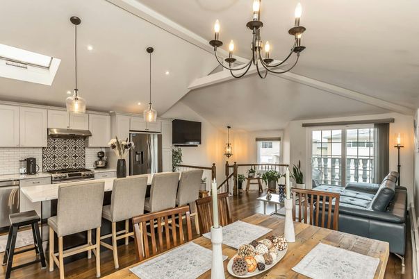 Chandelier, Dining room, Interior, Kitchen, Living room, Pendant Lights, Recessed Lighting, Stainless Steel Appliances, Wood Texture Flooring