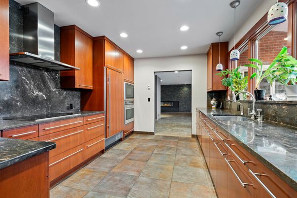 Fireplace, Interior, Kitchen, Pendant Lights, Recessed Lighting, Stainless Steel Appliances, Stone Walls