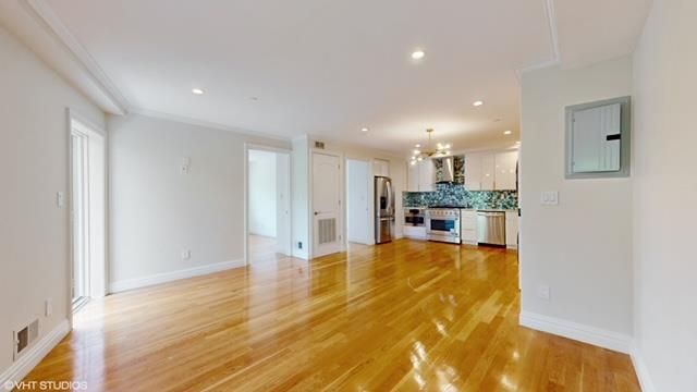 Chandelier, Empty room, Interior, Kitchen, Pendant Lights, Recessed Lighting, Stainless Steel Appliances, Wood Texture Flooring