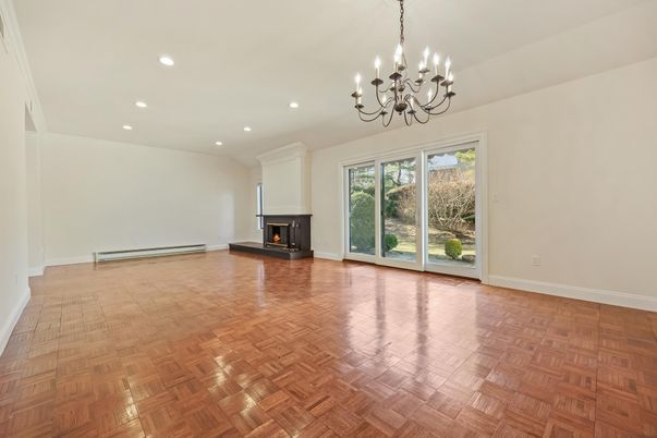 Chandelier, Empty room, Fireplace, Interior, Recessed Lighting, Wood Texture Flooring
