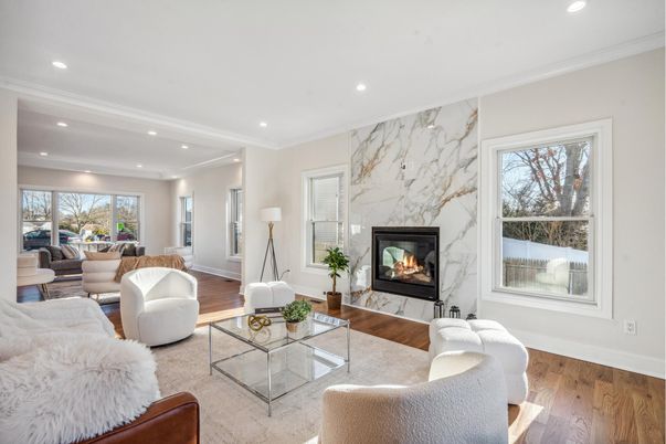 Fireplace, Interior, Living room, Marble Walls, Recessed Lighting, Wood Texture Flooring