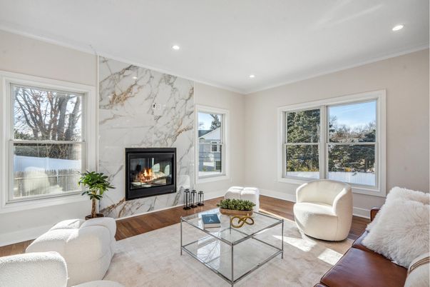Fireplace, Interior, Living room, Marble Walls, Recessed Lighting, Wood Texture Flooring