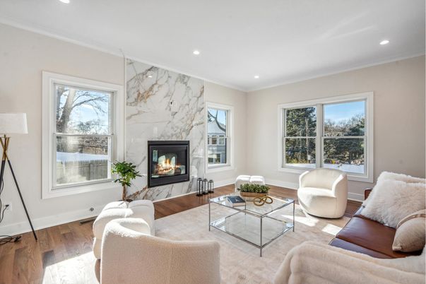 Fireplace, Interior, Living room, Marble Walls, Recessed Lighting, Wood Texture Flooring