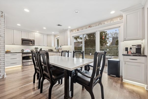 Dining room, Interior, Kitchen, Recessed Lighting, Stainless Steel Appliances, Wood Texture Flooring