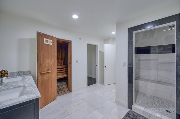 Bathroom, Dual Sink Vanities, Glass Shower, Interior, Marble, Recessed Lighting, Sauna Room