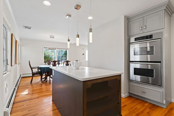 Dining room, Interior, Kitchen, Pendant Lights, Recessed Lighting, Stainless Steel Appliances, Wood Texture Flooring