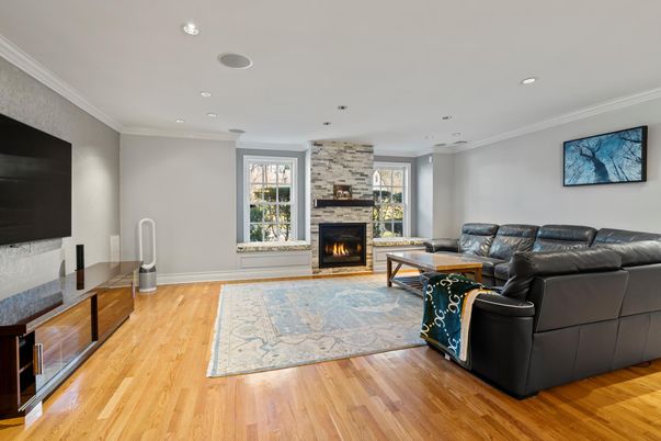 Fireplace, Interior, Living room, Recessed Lighting, Stone Walls, Wood Texture Flooring