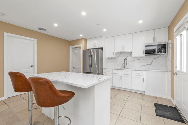 Interior, Kitchen, Marble Walls, Recessed Lighting, Stainless Steel Appliances