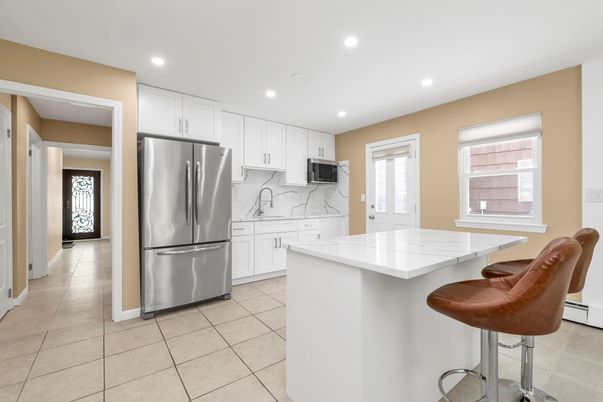 Interior, Kitchen, Marble Walls, Recessed Lighting, Stainless Steel Appliances