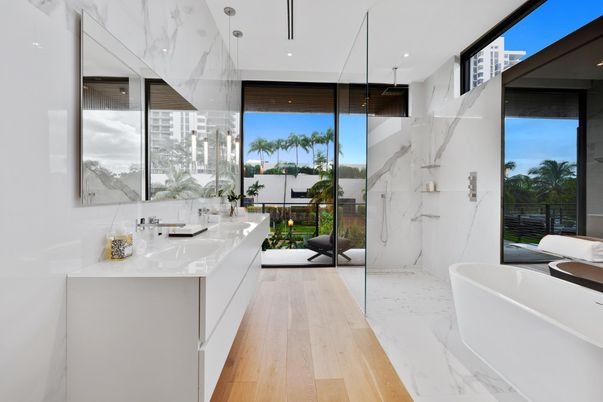 Bathroom, Dual Sink Vanities, Free Standing Baths, Glass Shower, Interior, Marble, Marble Walls, Recessed Lighting, Wood Texture Flooring