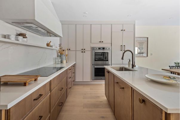 Interior, Kitchen, Marble Walls, Recessed Lighting, Stainless Steel Appliances, Wood Texture Flooring