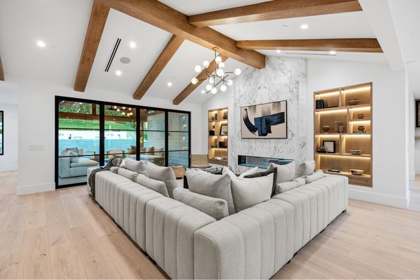 Fireplace, Interior, Living room, Marble Walls, Recessed Lighting, Water, Wooden Beams, Wood Texture Flooring