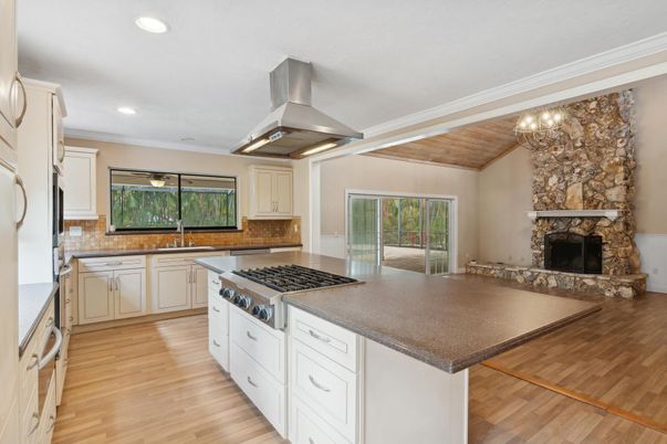 Chandelier, Fireplace, Interior, Kitchen, Pendant Lights, Recessed Lighting, Stone Walls, Wooden Ceilings, Wood Texture Flooring