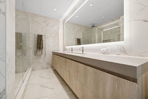Bathroom, Dual Sink Vanities, Glass Shower, Interior, Marble, Marble Walls, Recessed Lighting