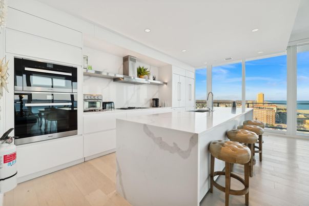 Interior, Kitchen, Marble Walls, Recessed Lighting, Stainless Steel Appliances, Water, Wood Texture Flooring