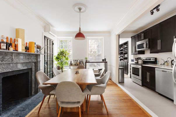 Dining room, Fireplace, Interior, Kitchen, Pendant Lights, Stainless Steel Appliances, Wood Texture Flooring