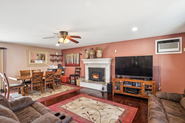Dining room, Fireplace, Interior, Living room, Recessed Lighting, Wood Texture Flooring