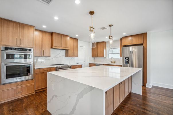 Interior, Kitchen, Marble Walls, Pendant Lights, Recessed Lighting, Stainless Steel Appliances, Wood Texture Flooring