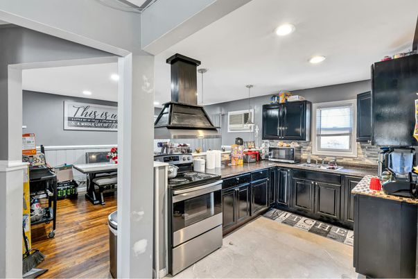 Dining room, Interior, Kitchen, Pendant Lights, Recessed Lighting, Stainless Steel Appliances, Wood Texture Flooring