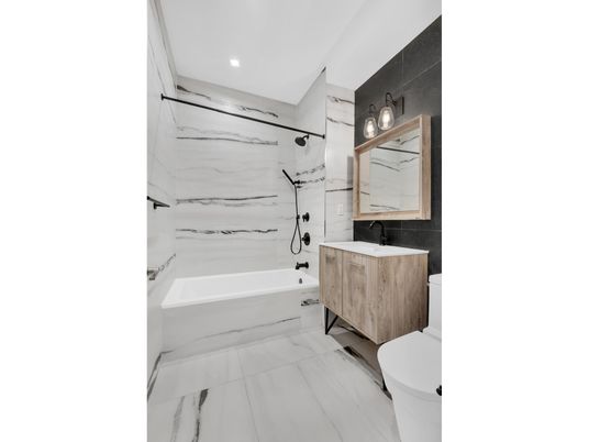 Bathroom, Dual Sink Vanities, Interior, Marble, Marble Walls, Recessed Lighting