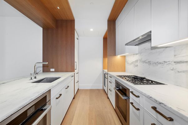 Interior, Kitchen, Marble Walls, Recessed Lighting, Stainless Steel Appliances, Wood Texture Flooring