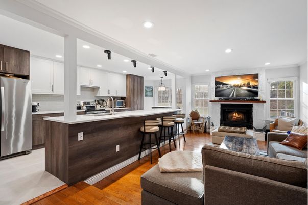 Fireplace, Interior, Kitchen, Living room, Pendant Lights, Recessed Lighting, Stainless Steel Appliances, Wood Texture Flooring