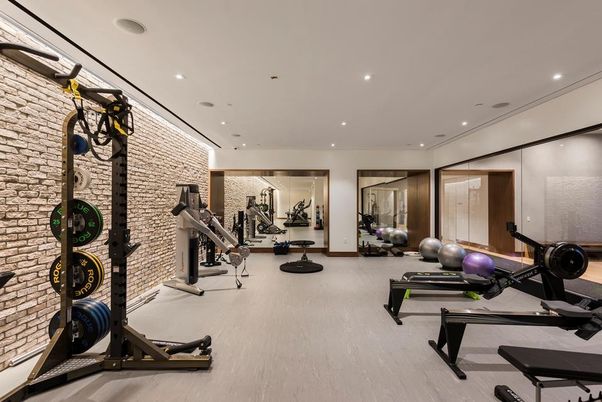 Fitness Equipment, Gym, Interior, Recessed Lighting, Stone Walls, Wood Texture Flooring