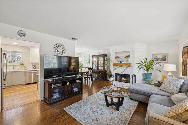 Dining room, Fireplace, Interior, Kitchen, Living room, Recessed Lighting, Stainless Steel Appliances, Wood Texture Flooring