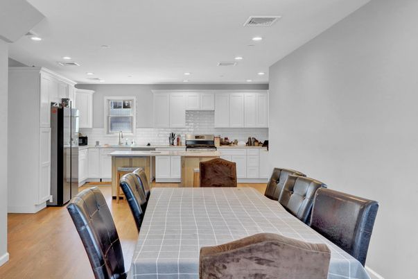 Interior, Kitchen, Recessed Lighting, Stainless Steel Appliances, Tile Countertops, Wood Texture Flooring