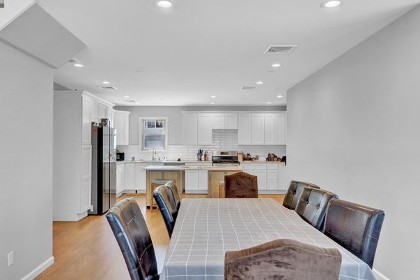 Dining room, Interior, Kitchen, Recessed Lighting, Stainless Steel Appliances, Tile Countertops, Wood Texture Flooring