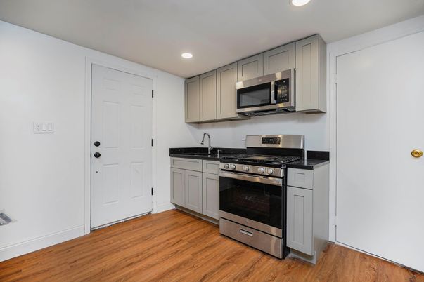Interior, Kitchen, Recessed Lighting, Stainless Steel Appliances, Wood Texture Flooring