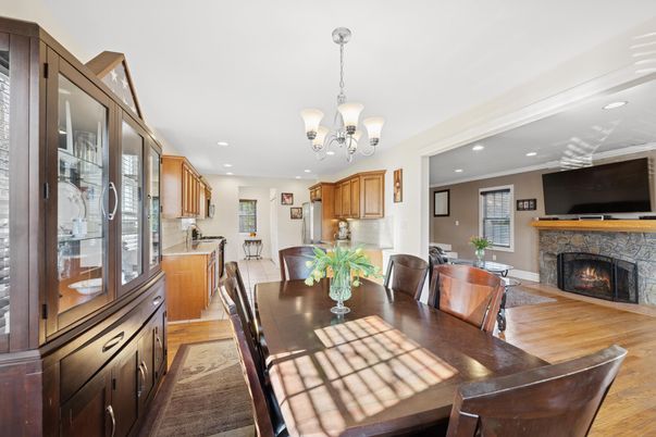 Chandelier, Dining room, Fireplace, Interior, Kitchen, Recessed Lighting, Wood Texture Flooring