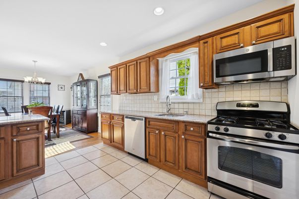 Chandelier, Dining room, Interior, Kitchen, Recessed Lighting, Stainless Steel Appliances, Wood Texture Flooring