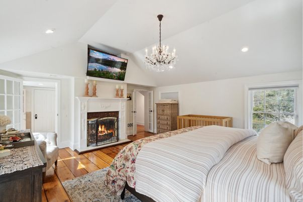 Bedroom, Chandelier, Fireplace, Interior, Recessed Lighting, Wood Texture Flooring
