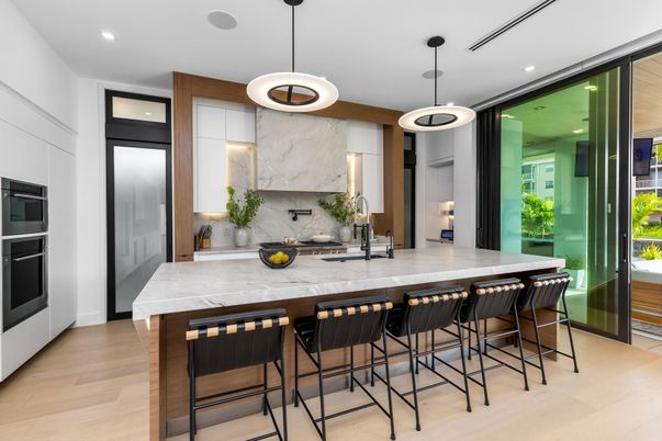 Interior, Kitchen, Marble Walls, Pendant Lights, Recessed Lighting, Stainless Steel Appliances, Wood Texture Flooring