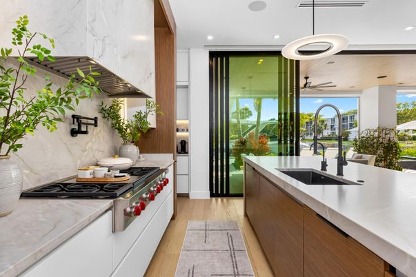 Interior, Kitchen, Marble Walls, Pendant Lights, Recessed Lighting, Stainless Steel Appliances, Wood Texture Flooring