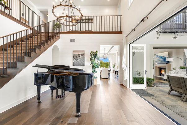 Chandelier, Fireplace, Interior, Piano, Recessed Lighting, Wood Texture Flooring