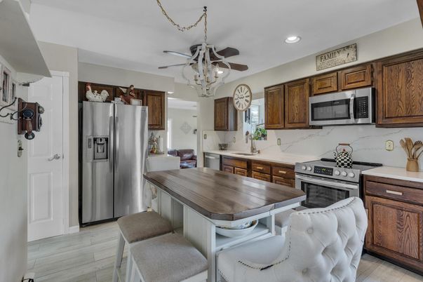 Dining room, Interior, Kitchen, Recessed Lighting, Stainless Steel Appliances, Wood Texture Flooring