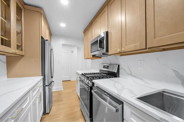 Interior, Kitchen, Marble Walls, Recessed Lighting, Stainless Steel Appliances, Wood Texture Flooring